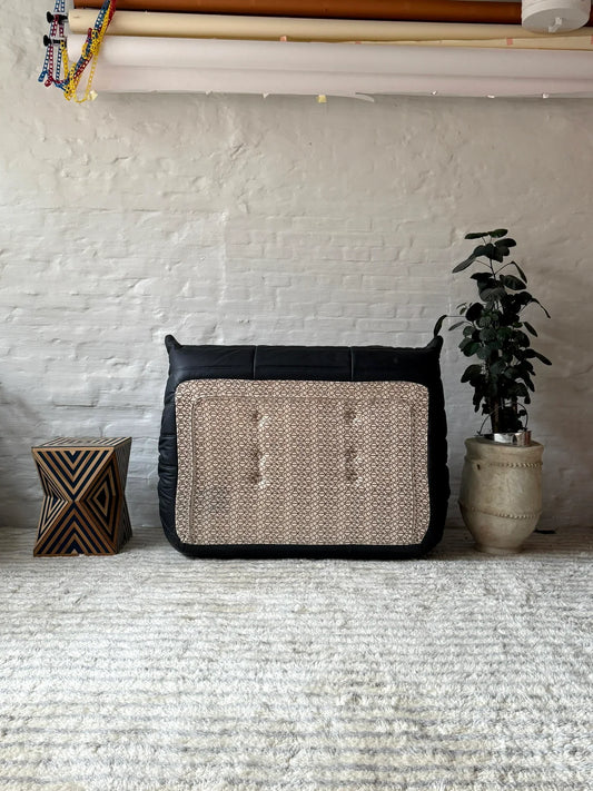 Modern Togo loveseat sofa with ergonomic design and caterpillar sofa style in living room