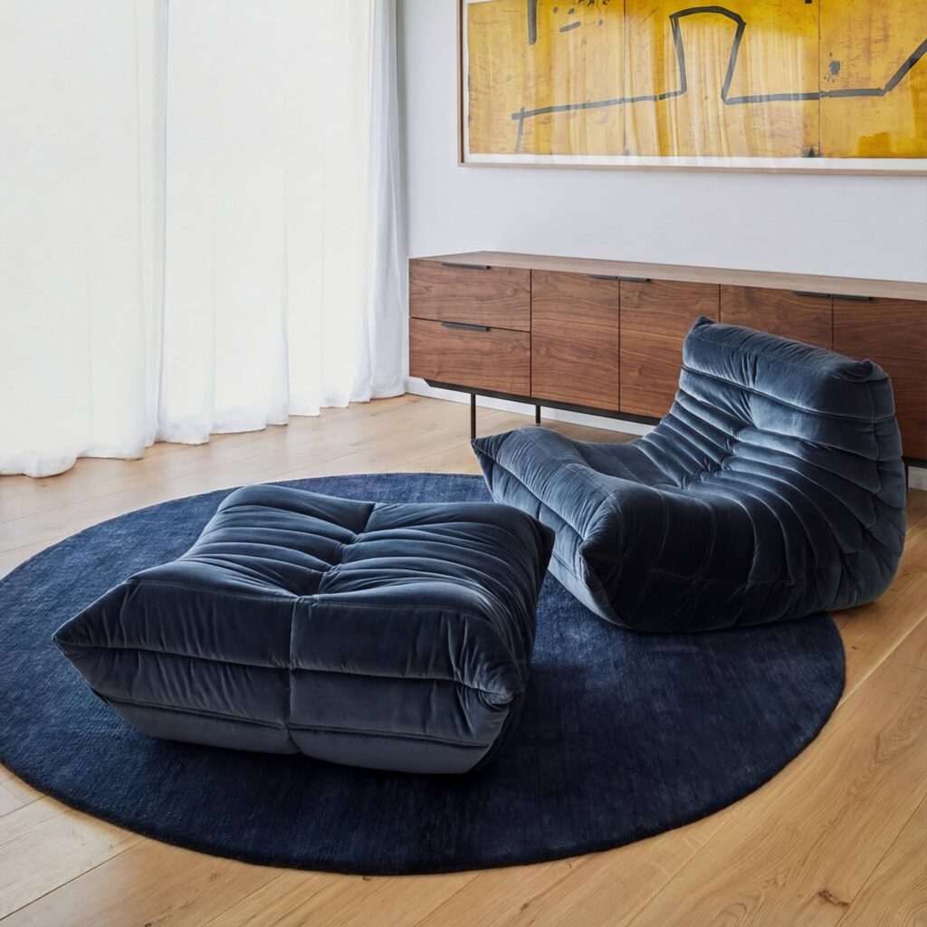 Togo Ottoman modular foam footrest and seat with a low-profile casual design