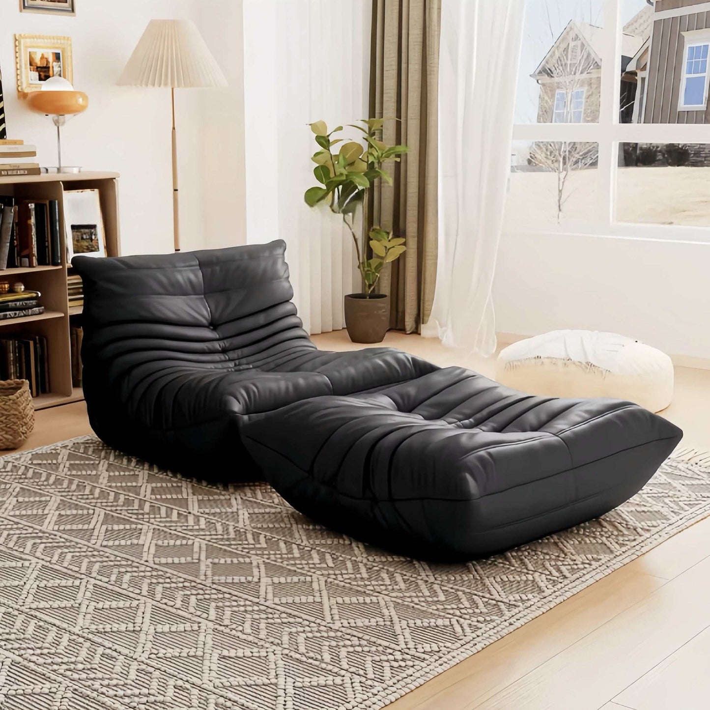black leather armchair and ottoman set in modern living room