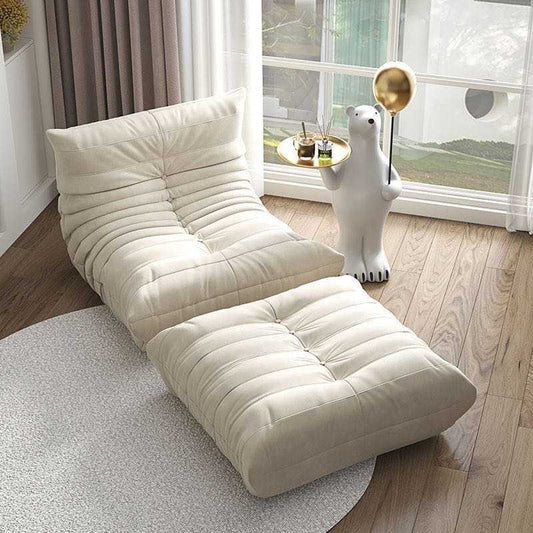 Modern Caterpillar Fireside Chair and Footstool set upholstered in suede for stylish home relaxation