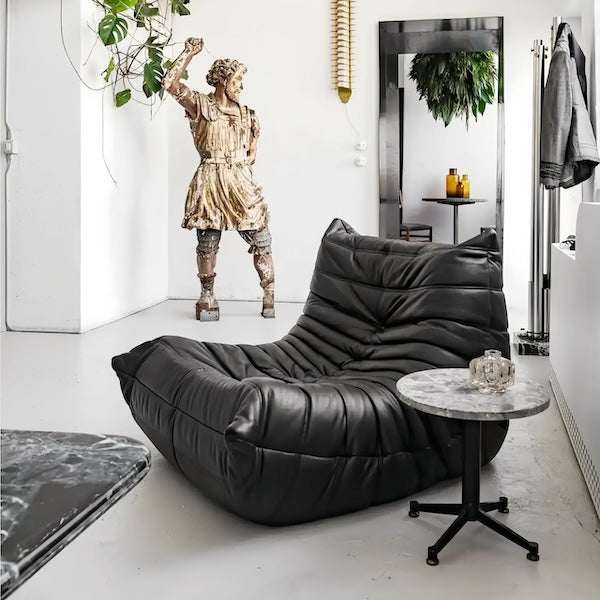 Leather armchair replica in plush teddy leather with ergonomic foam design and hand-sewn tuft detailing