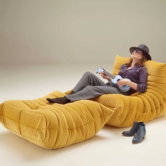 modern yellow suede armchair and ottoman with contoured design for comfort and style